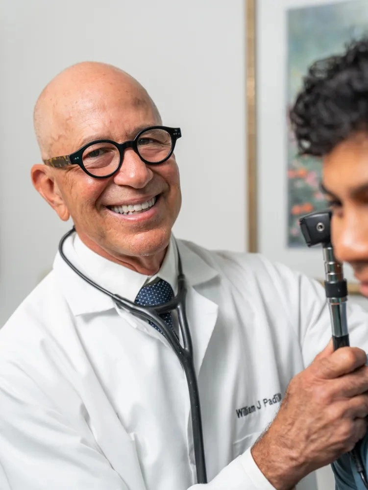 Dr. William Padilla engaged in a face-to-face health discussion with a patient.
